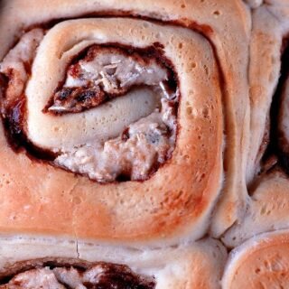 Oatmeal Raisin Cookie Cinnamon Rolls with Caramel Glaze