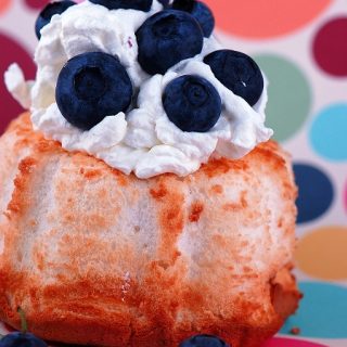 Angel Food Cake with White Chocolate Cocoa Whipped Cream Frosting