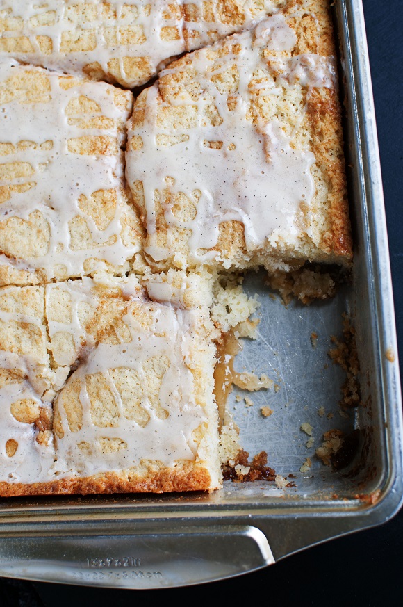 Overhead shot of apple pie cake with piece missing.