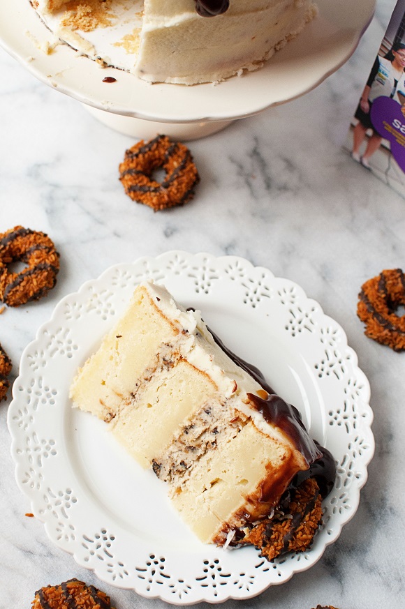 Slice of Samoa Mascarpone Layer Cake on plate