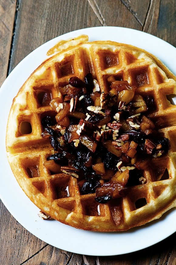 Overhead shot of Malted Yeast Waffle  and compote on a plate. 