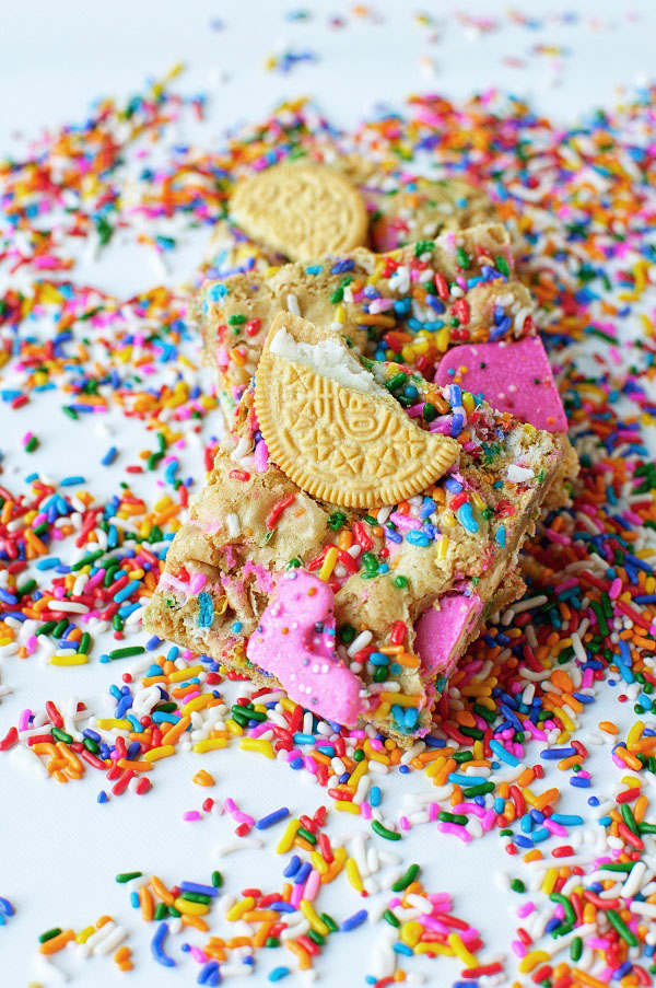 Kitchen Sink Circus Animal Oreo Blondies with Sprinkles all around them.