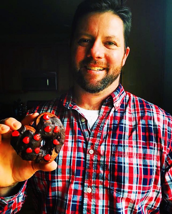 Hubby holding Chocolate-Cinnamon Cinnamon Rolls