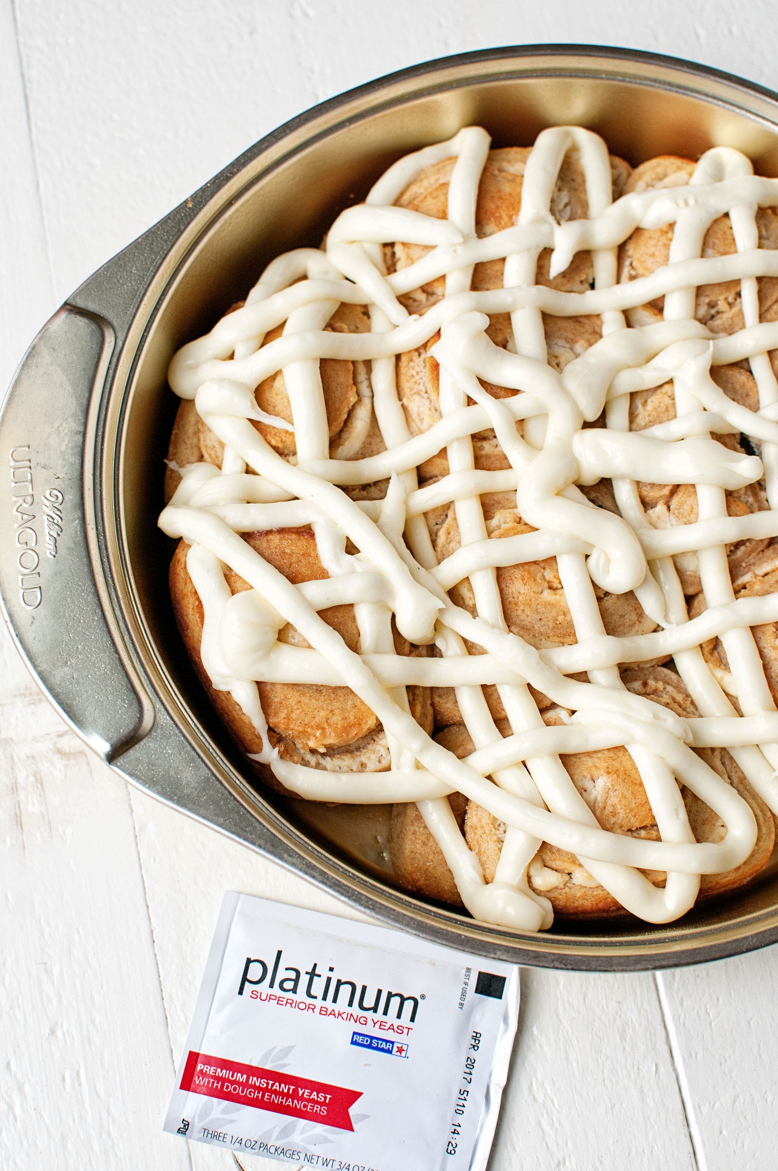 Overhead shot of rolls with icing. 