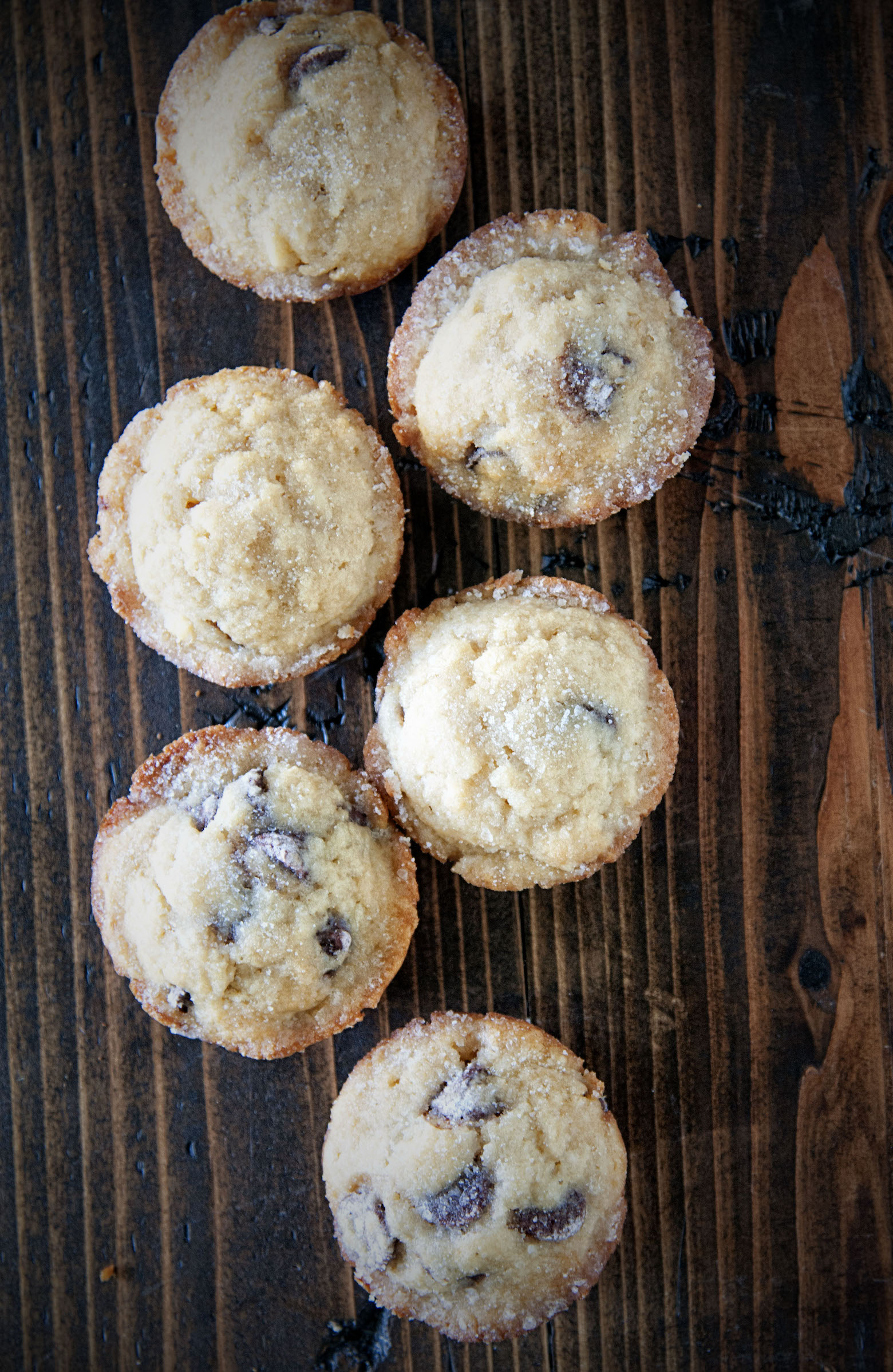 Overhead shot of six Whiskey Glazed Chocolate Chip Muffins