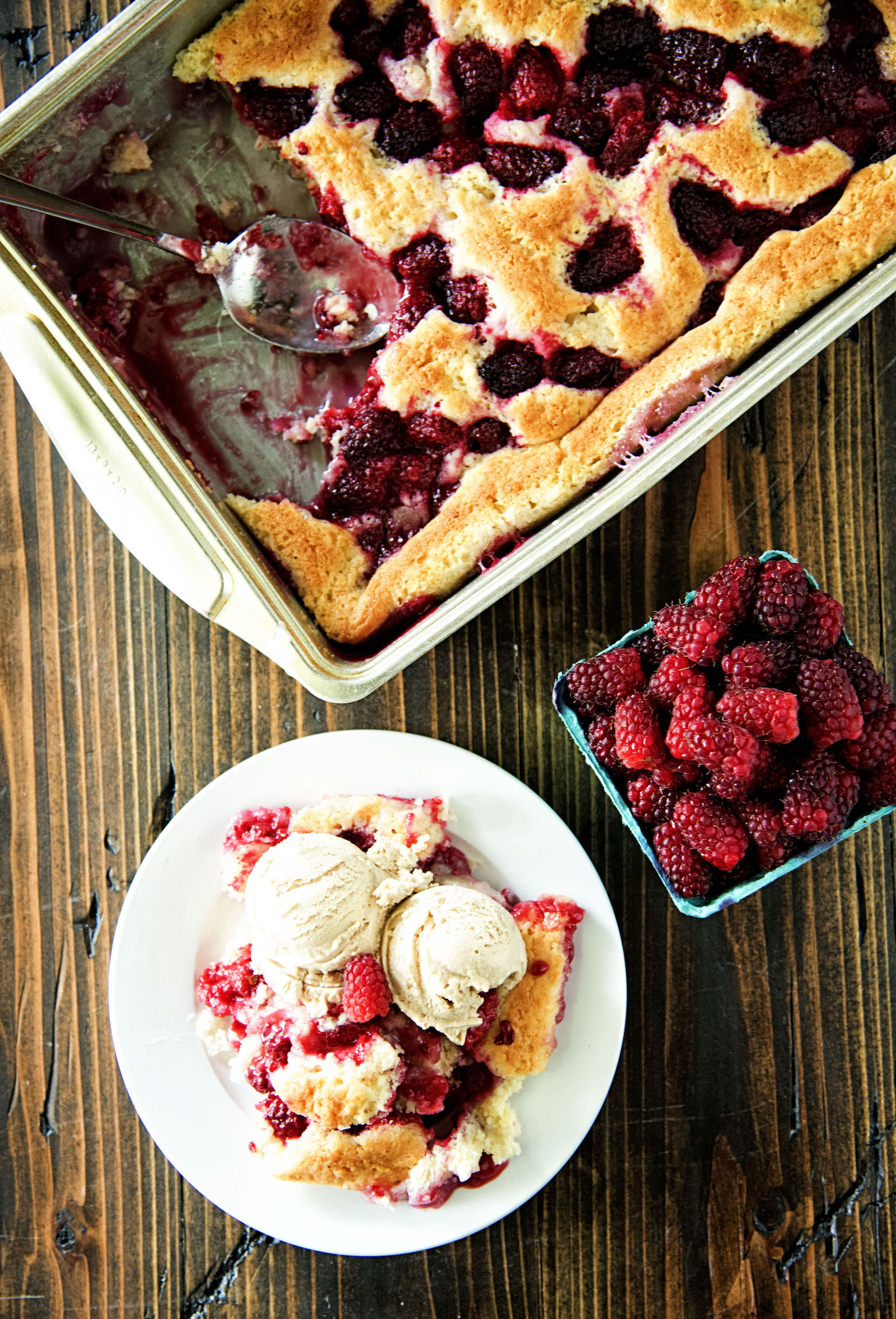 Tayberry Cobbler with scoops out of it from an overhead shot. 