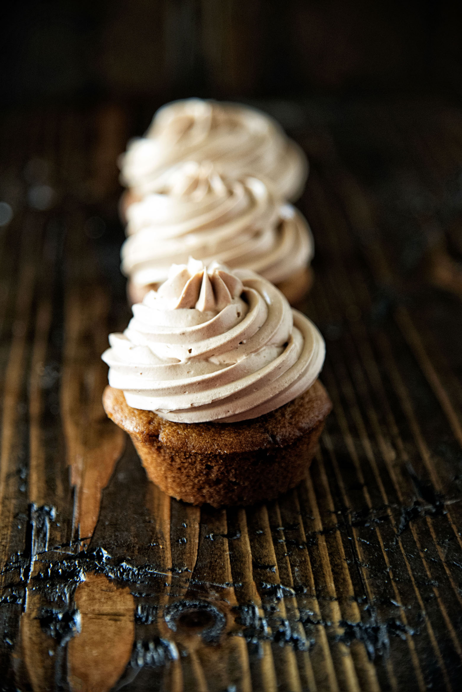 Row Chocolate Cinnamon Frosted Pumpkin Cupcakes going front to back.
