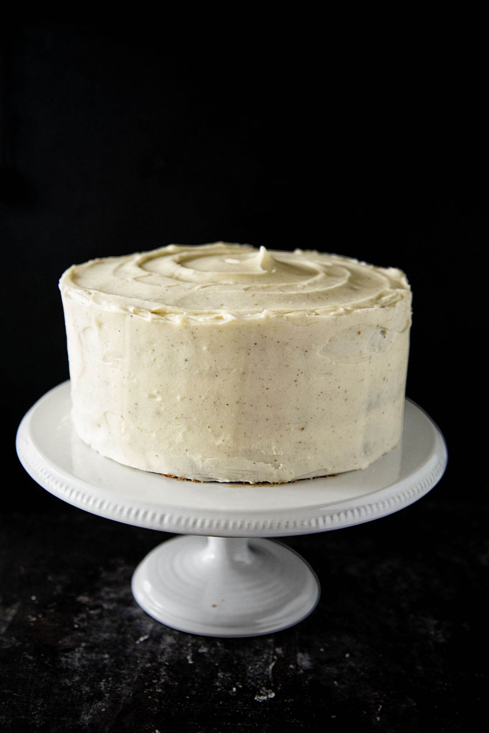 Side view of full Chai Spice Brown Butter Carrot Cake