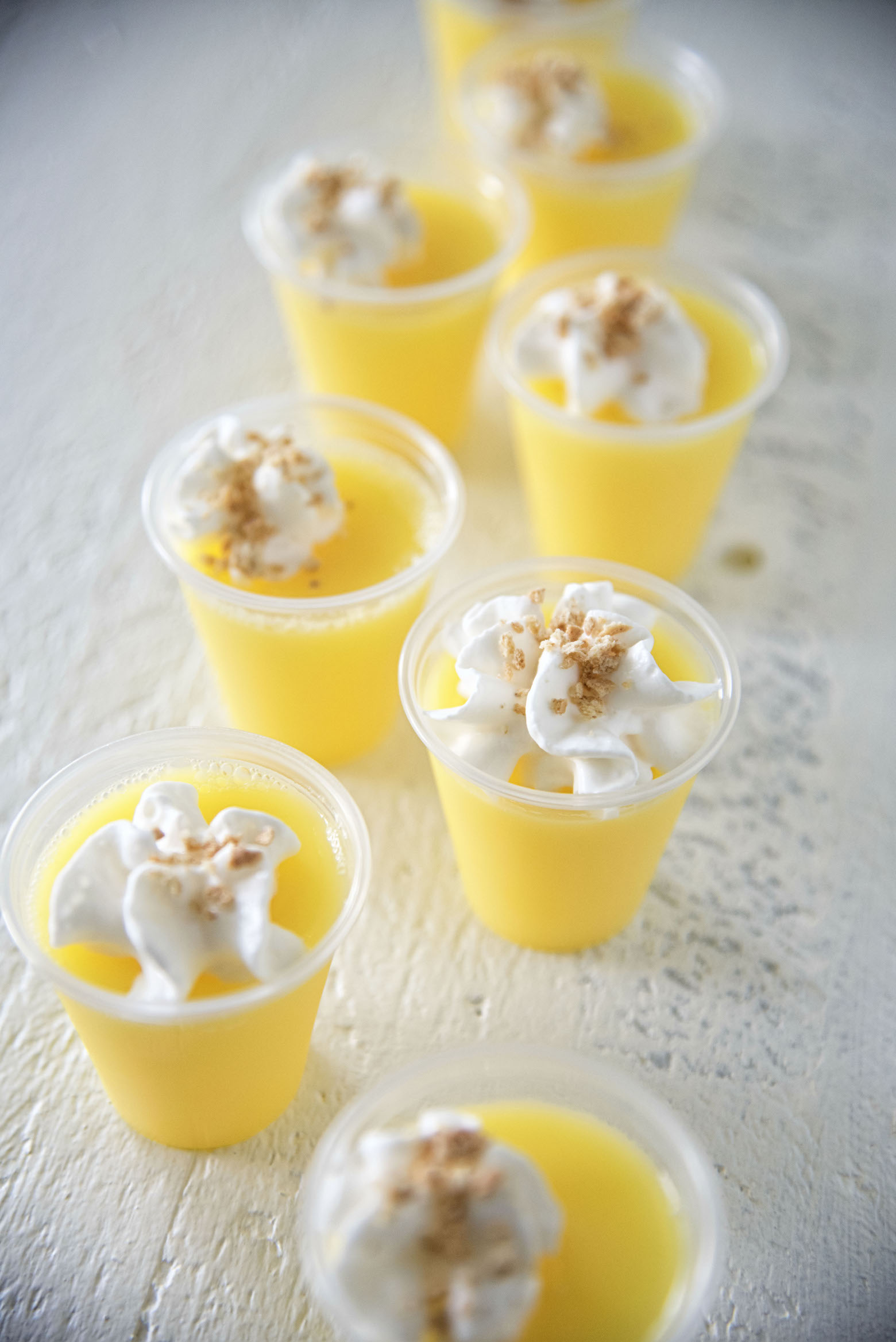 Lemon Cheesecake Jell-O Shots in a row