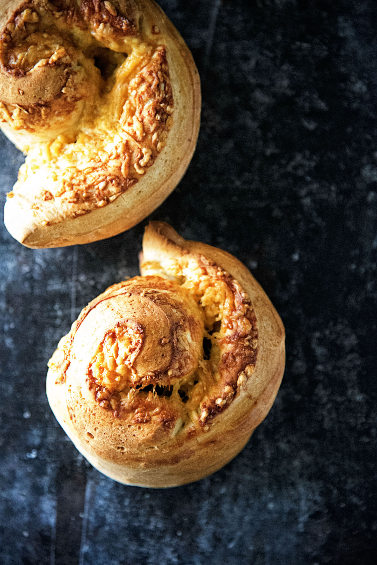 Overhead shot of two Gouda Stuffed Crusty Loaves