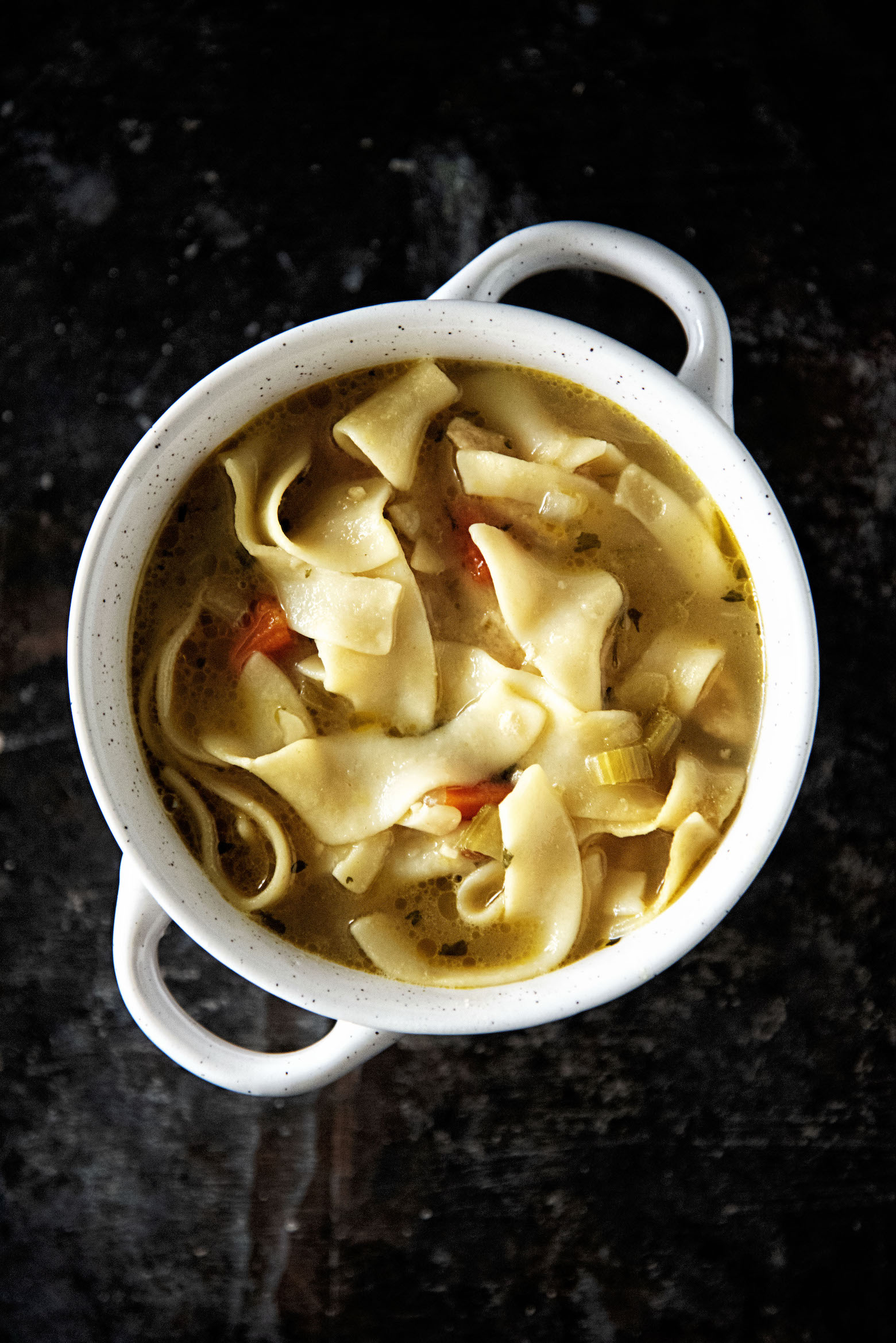 Up close overhead shot of Chickenless-Chicken Noodle Soup in a bowl.