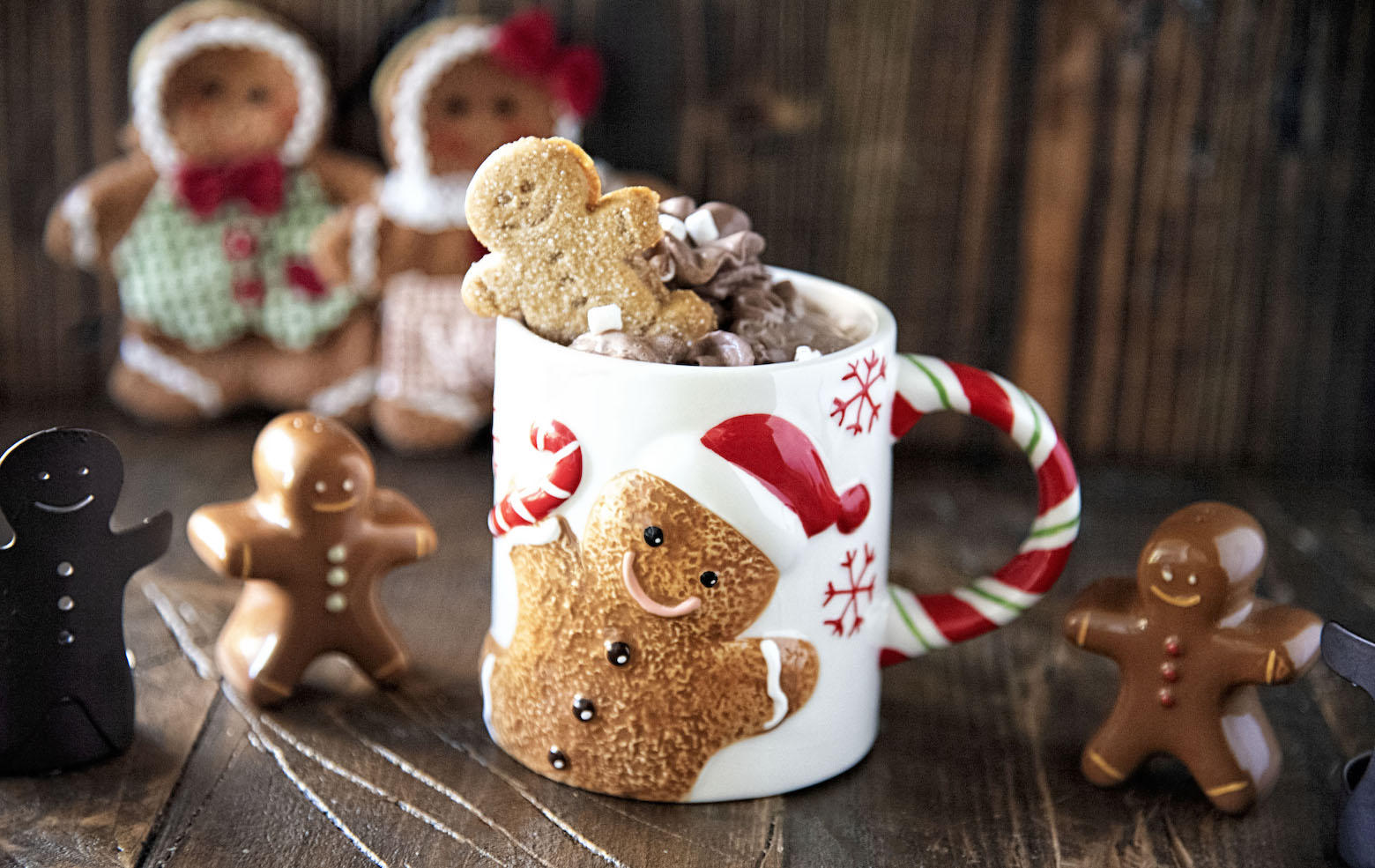 Side view of Spiked Gingerbread Hot Chocolate with gingerbread figurines 