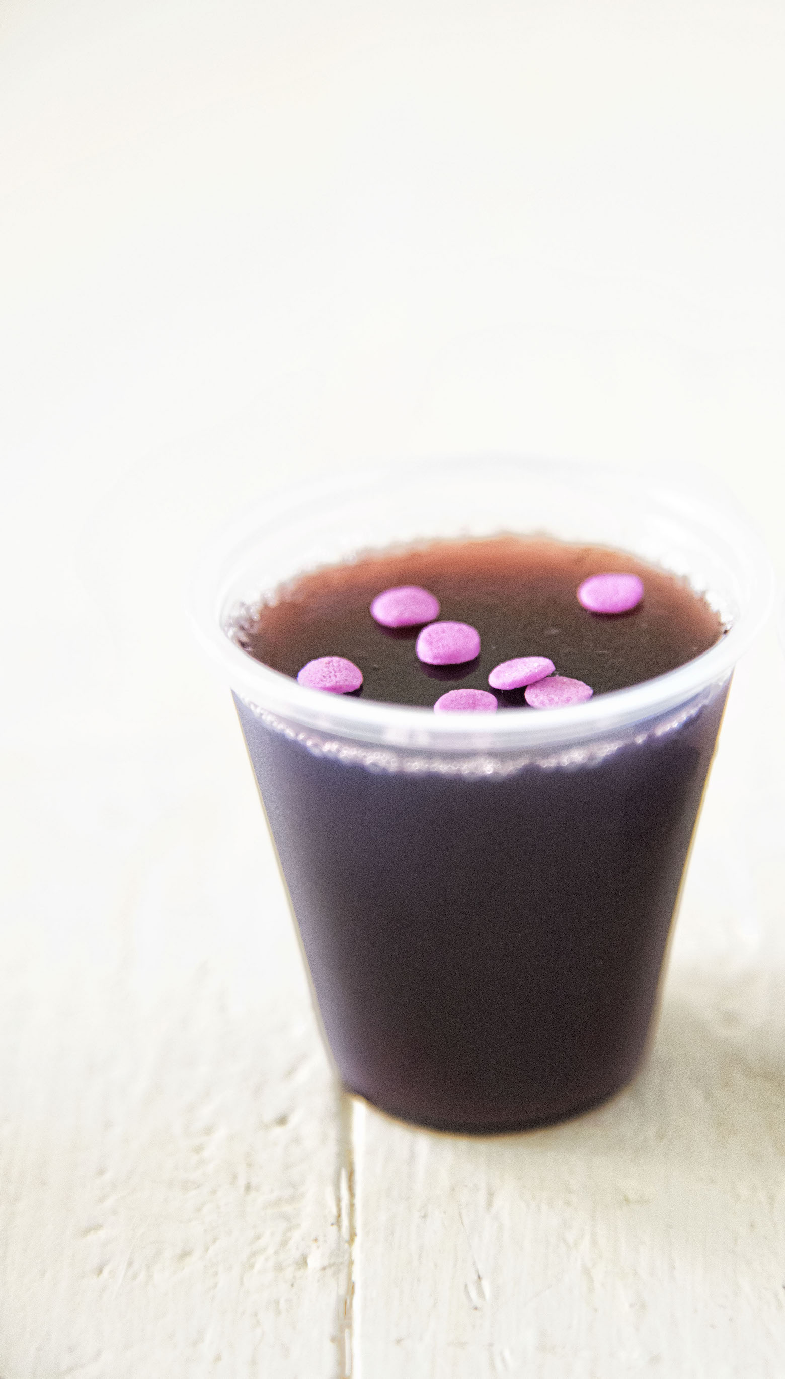 Single shot of Grape Limeade Vodka Jello Shot