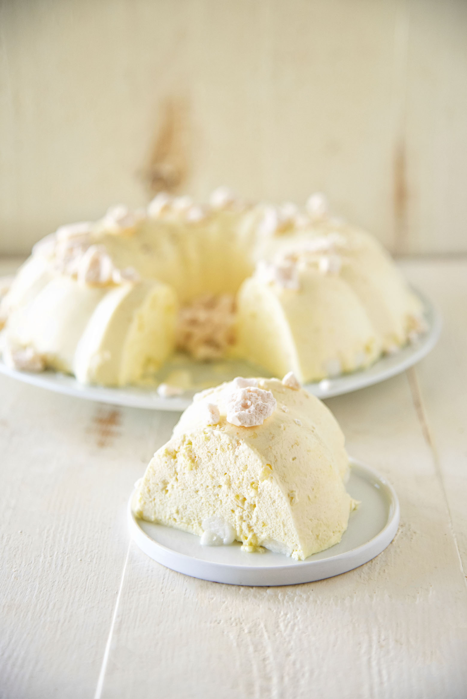 Lemon Meringue Pie Jell-O Salad with slice out of the mold.