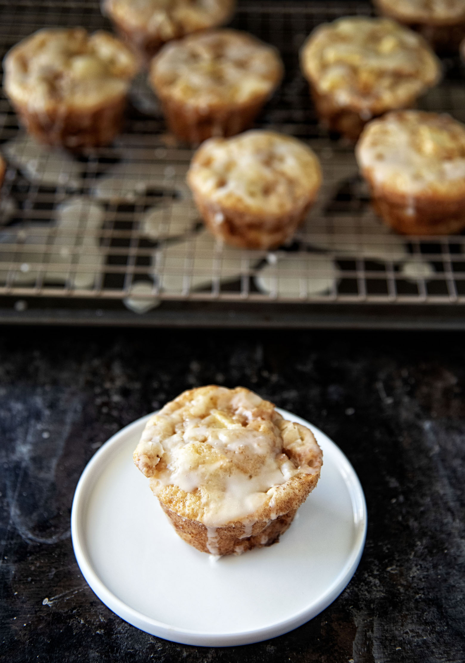 Cider Glazed Apple Fritter Muffins on a plate