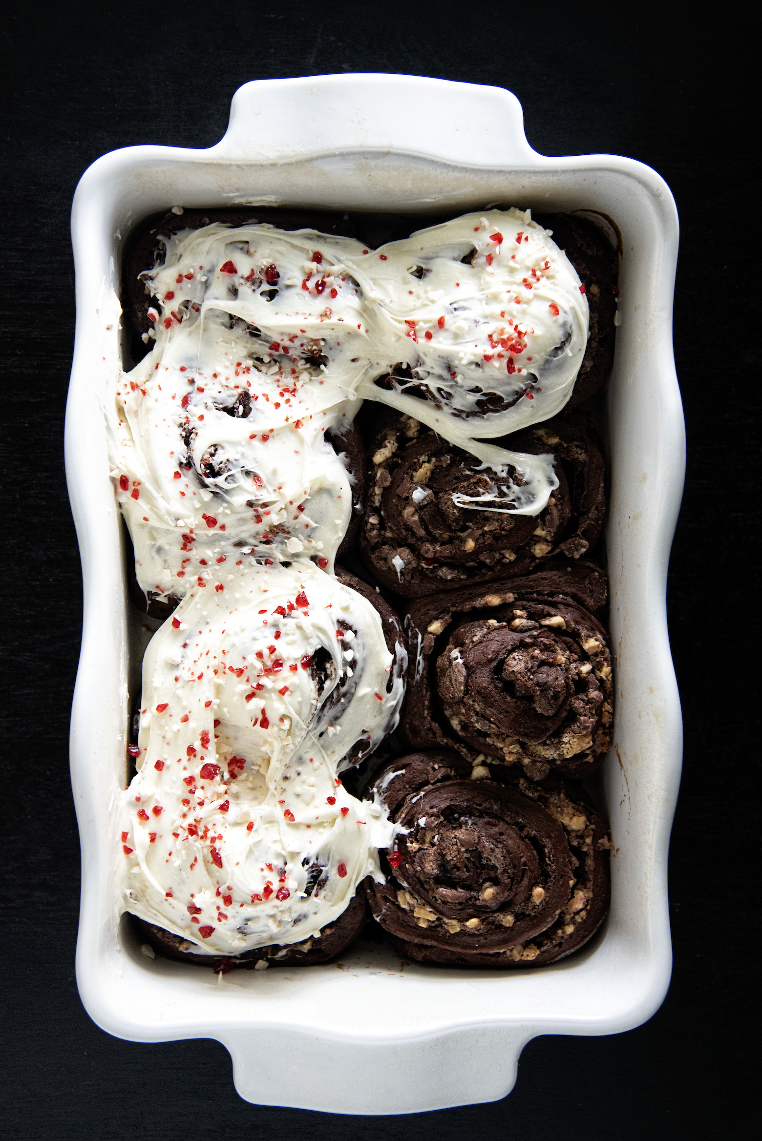 Overhead shot of Peppermint Mocha Latte Sweet Rolls in a baking dish. 