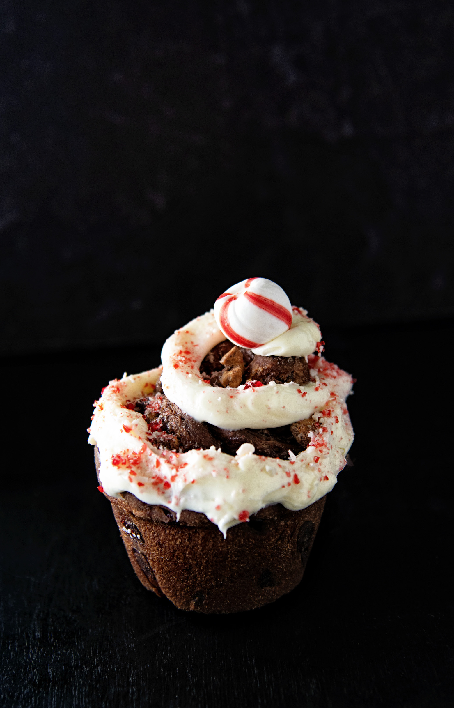 Single Peppermint Mocha Latte Sweet Roll with black background.