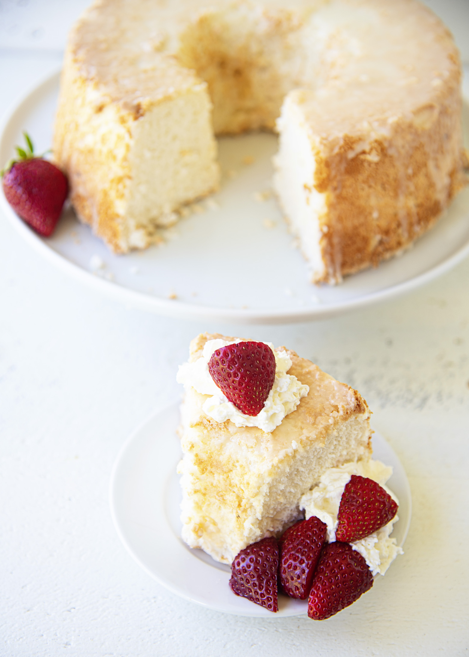 Overhead photo of Key Lime Angel Food Cake with piece cut out