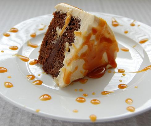 Bailey's Caramel Irish Cream Cake on a plate with caramel splatters