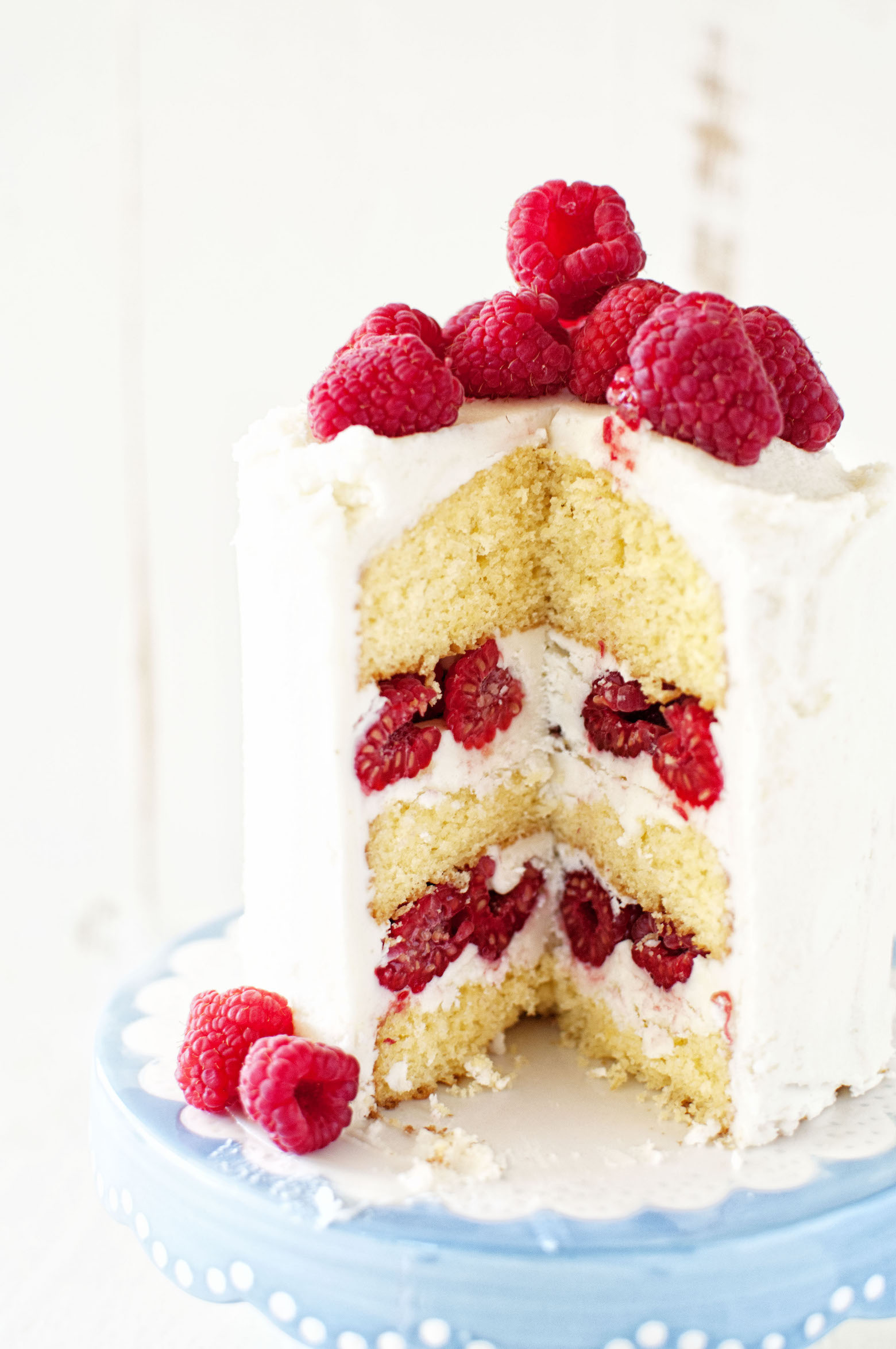 Sweet Corn and Raspberry Layer Cake with slice missing