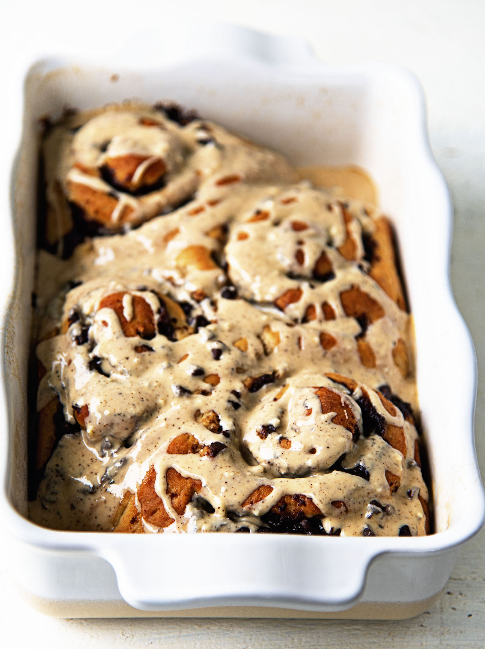 Side view of Banana Espresso Chocolate Sweet Rolls in a pan