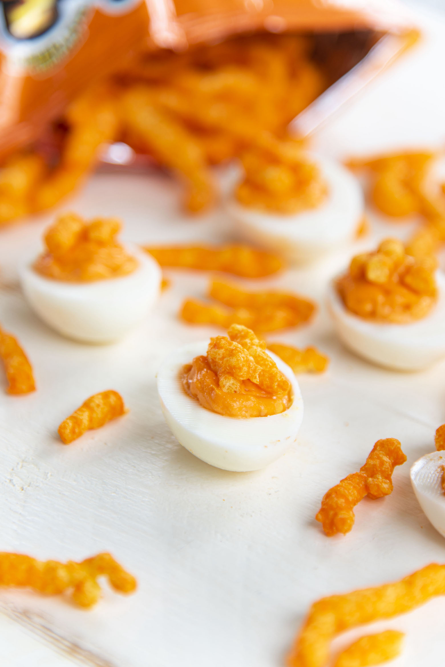 Cheetos Deviled Eggs coming out of the bag of Cheetos 