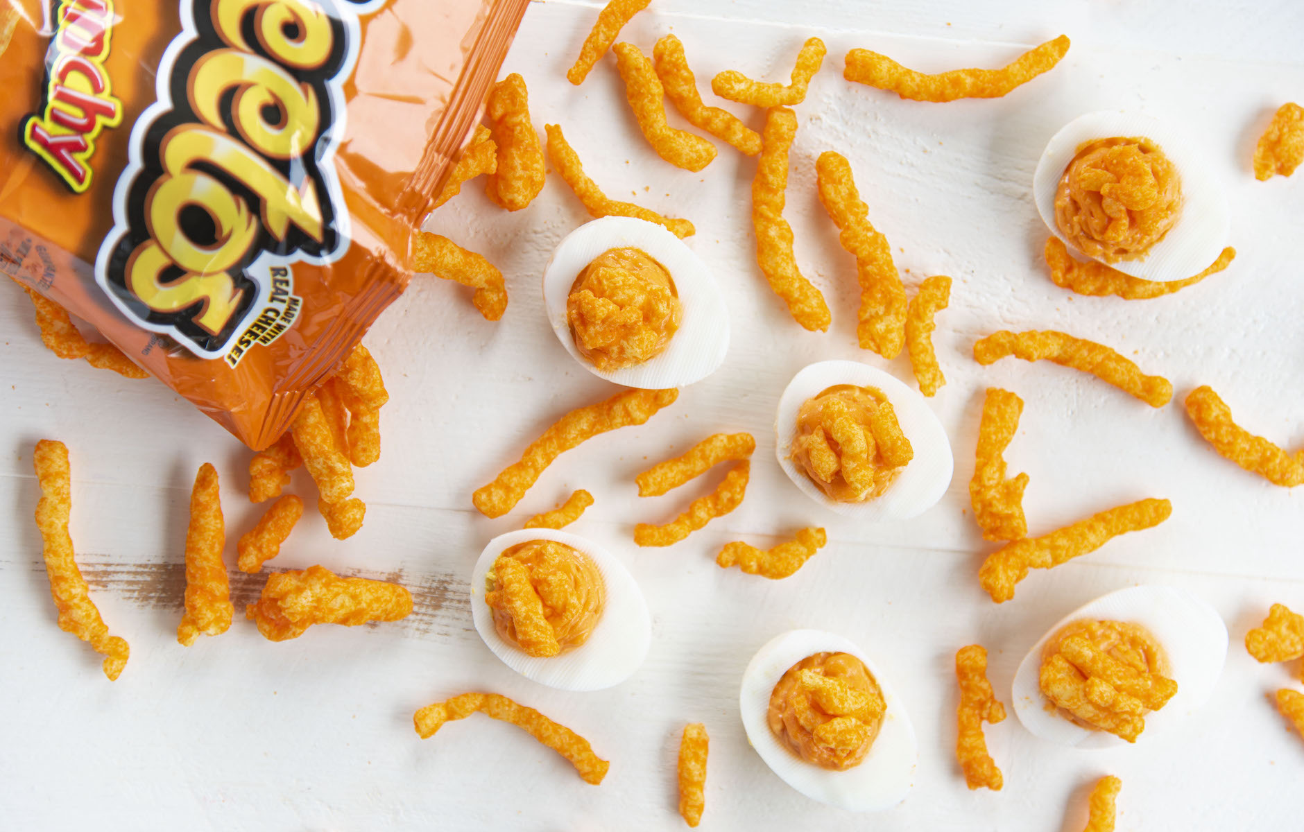 These Cheetos Deviled Eggs bring a favorite snack food and a popular appeti...