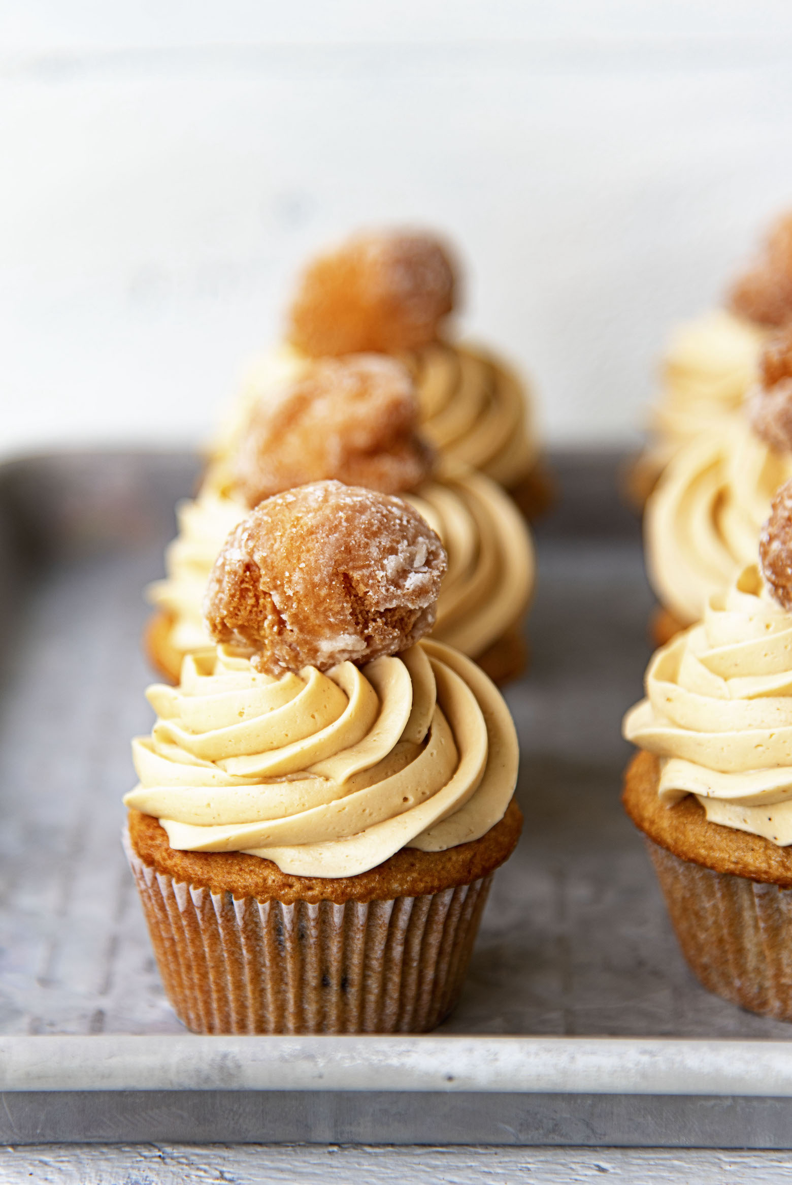 Coffee Chocolate Chip and Glazed Donut Cupcakes on a pan