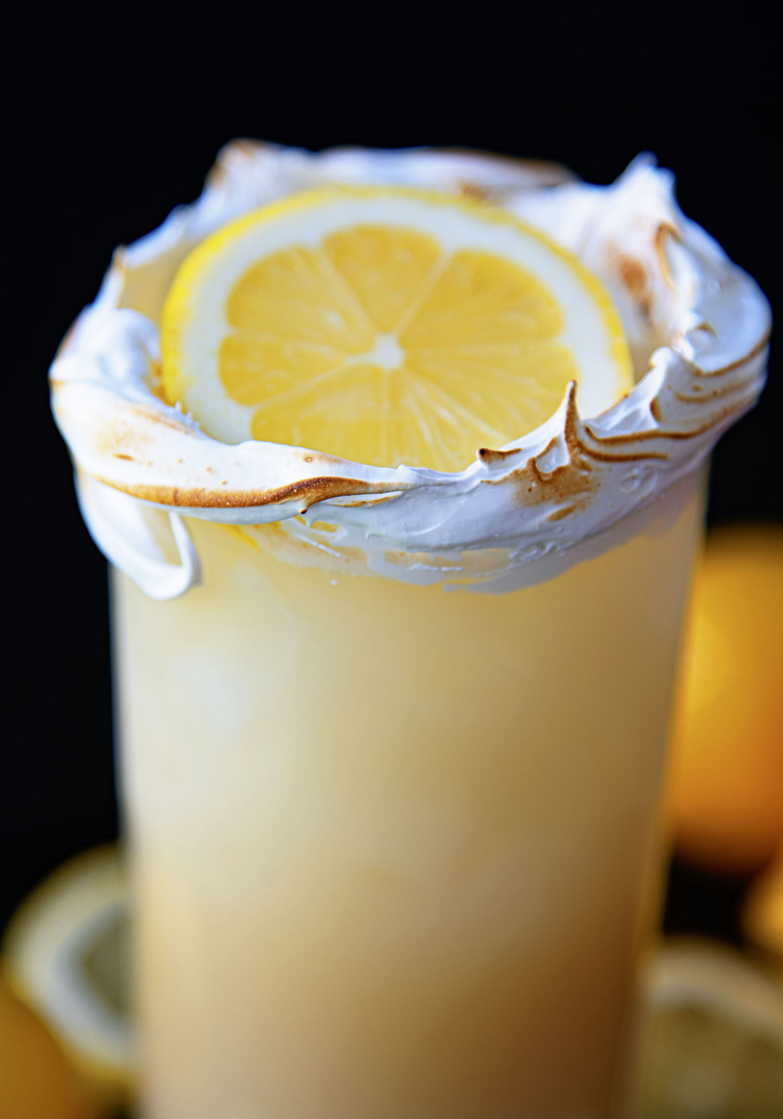 Up close shot of the cocktail and the lemon.
