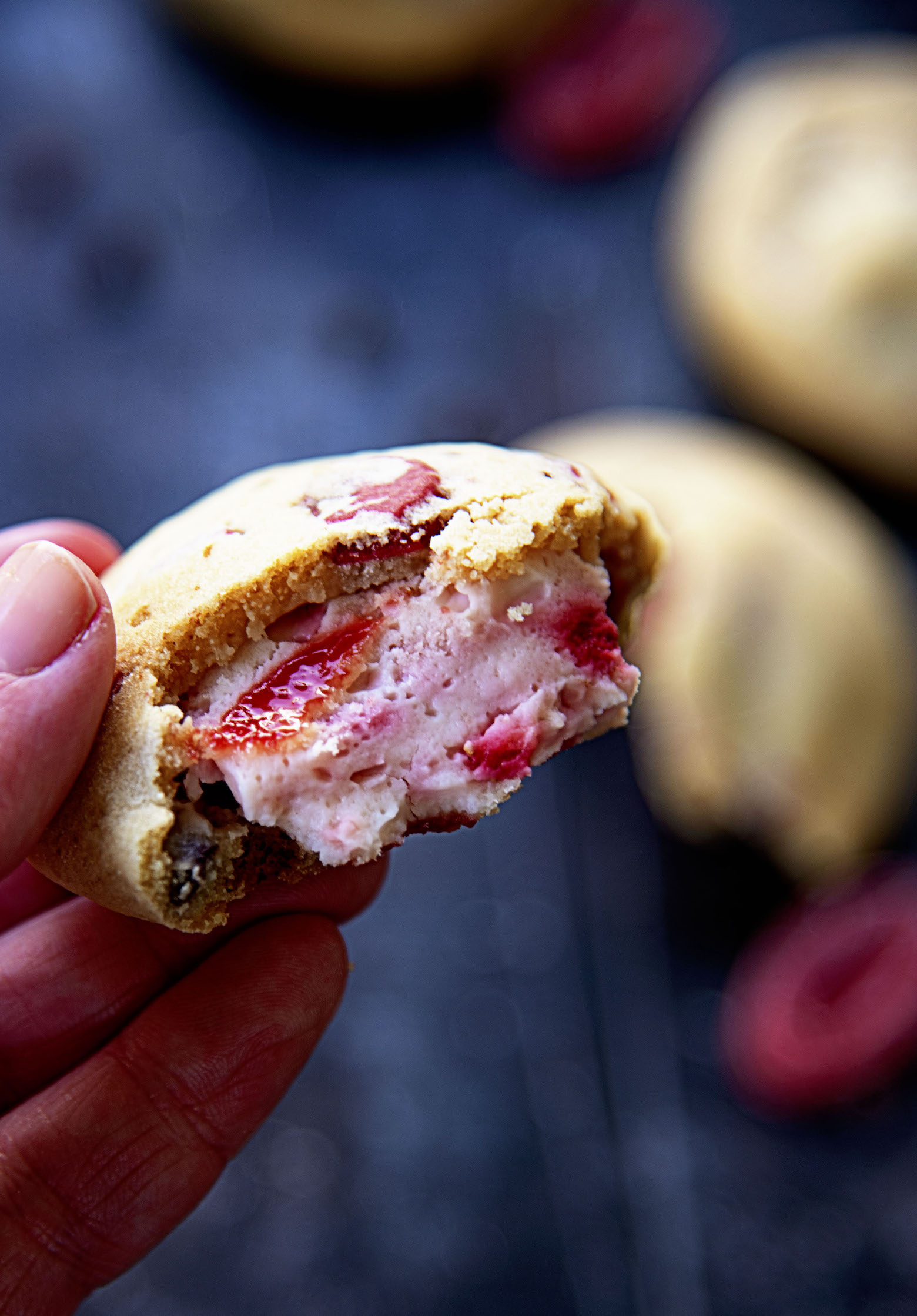 Hand holding open cookie. 