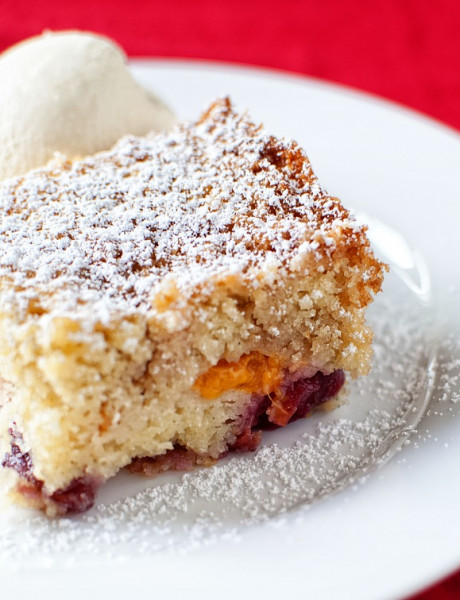 Apricot Cherry Buckle with Powdered Sugar and Whipped Cream