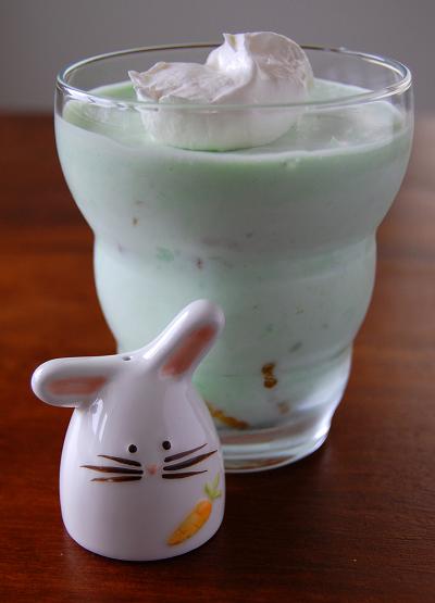 Lime Green Jello Salad in a glass jar with bunny figurine next to it. 