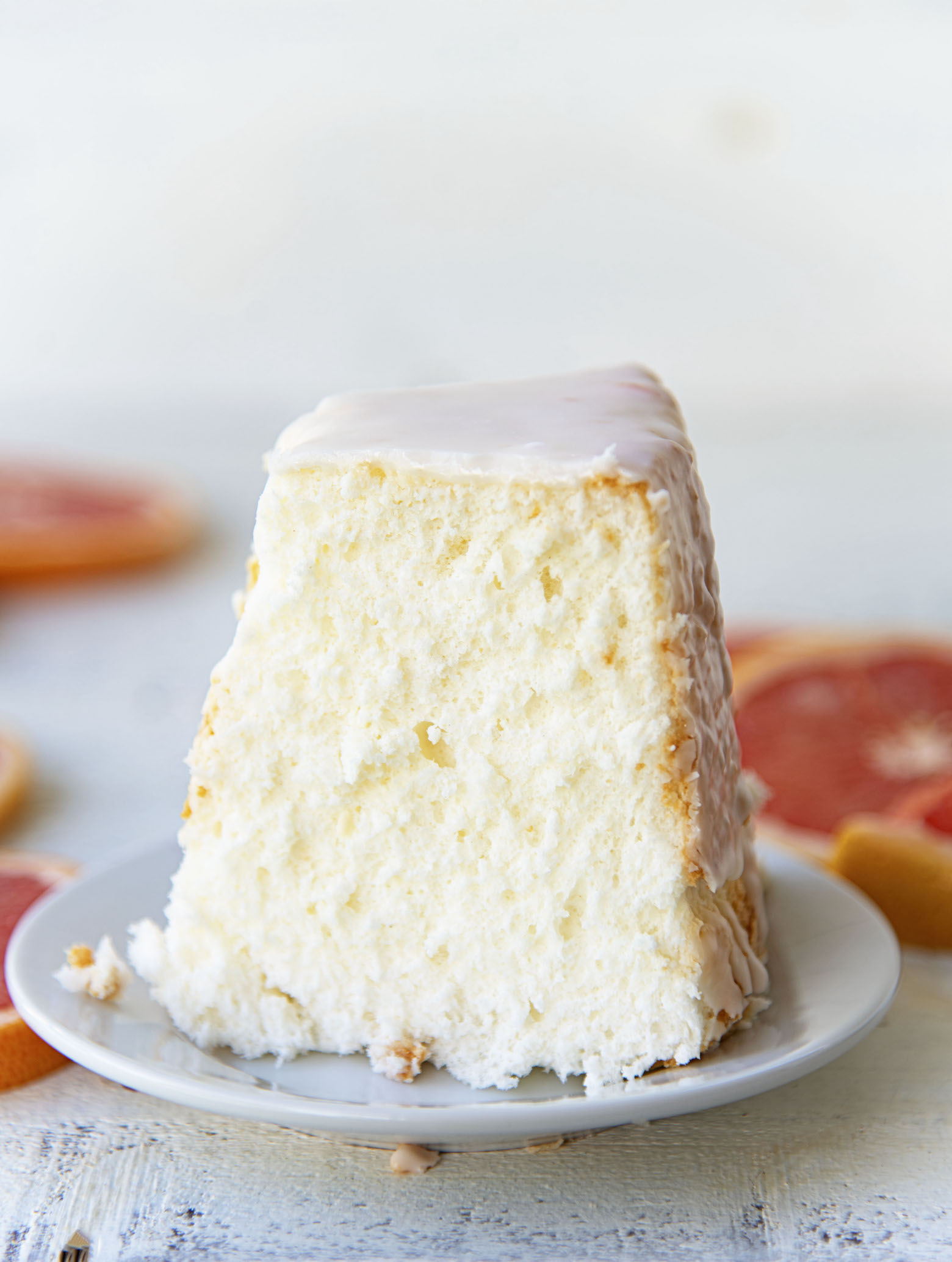 Side view of slice of Ruby Red Grapefruit Glazed Angel Food Cake 