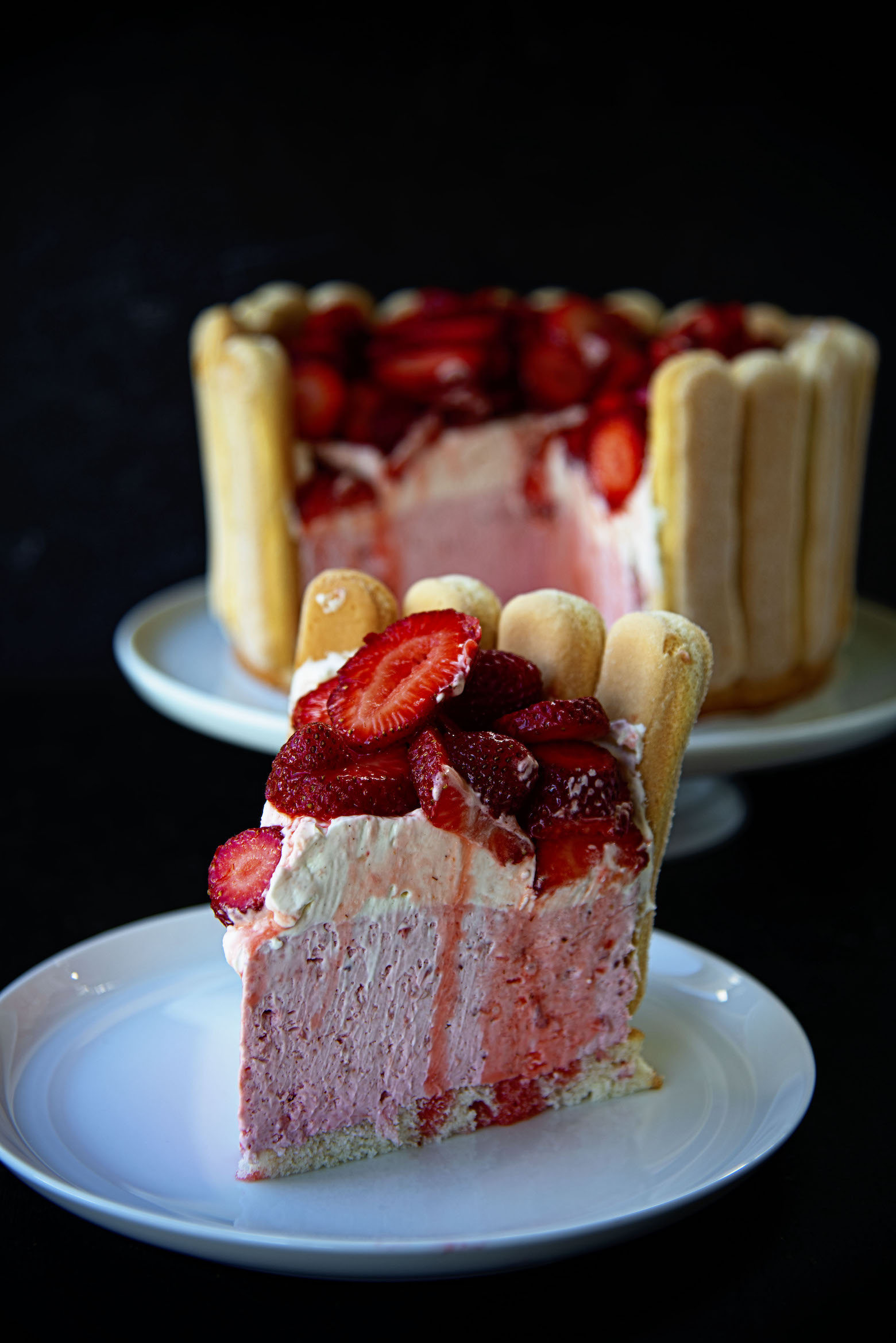 Side view of Strawberry Shortcake Charlotte Russe slice on plate. 