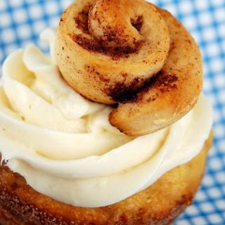 Cinnamon Roll Cupcakes with Cheesecake Frosting topped with Mini Cinnamon Rolls
