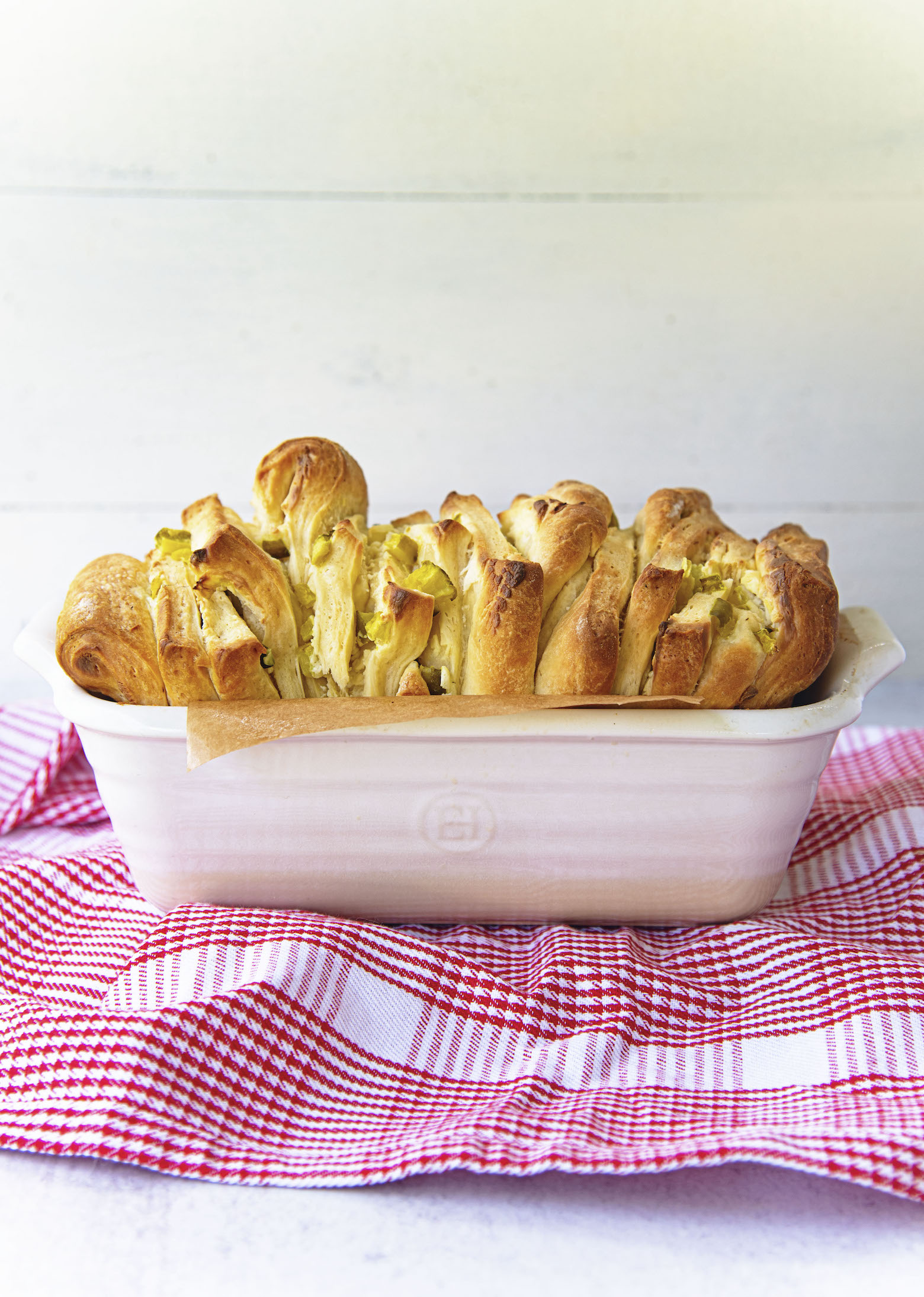 Side view of Dill Pickle Cream Cheese Pull Apart Bread in pan