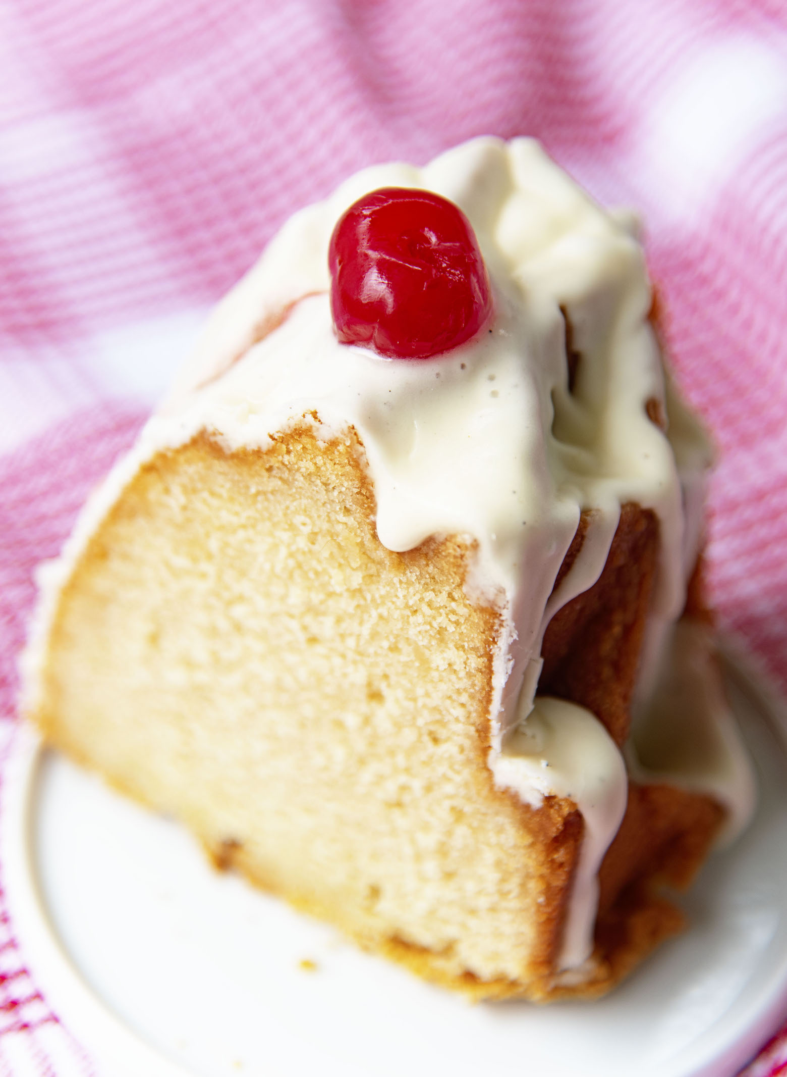 Close up of Root Beer Float Bundt Cake slice on plate. 