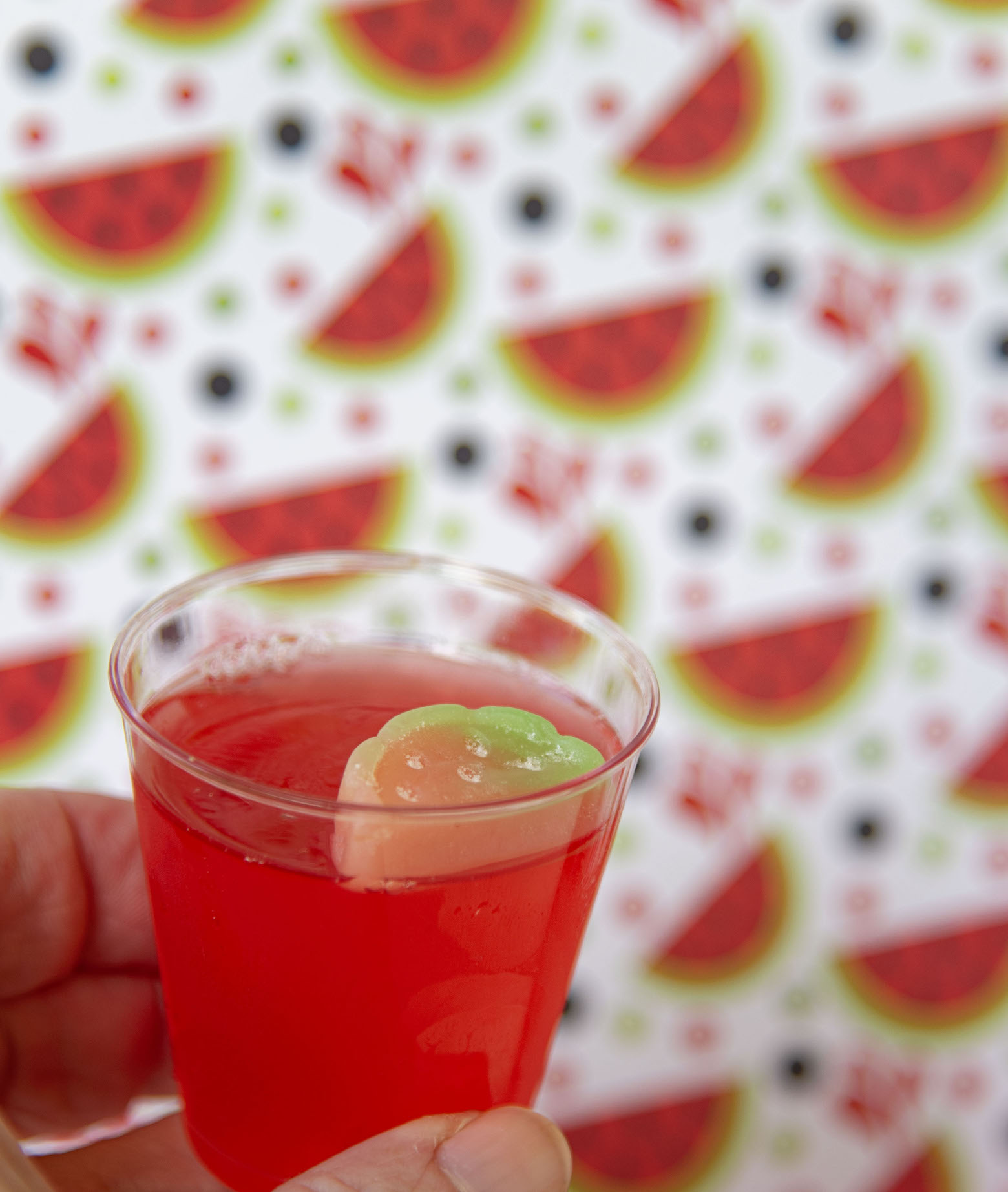 Up close shot of Watermelon Lemonade Jello Shot in my hand