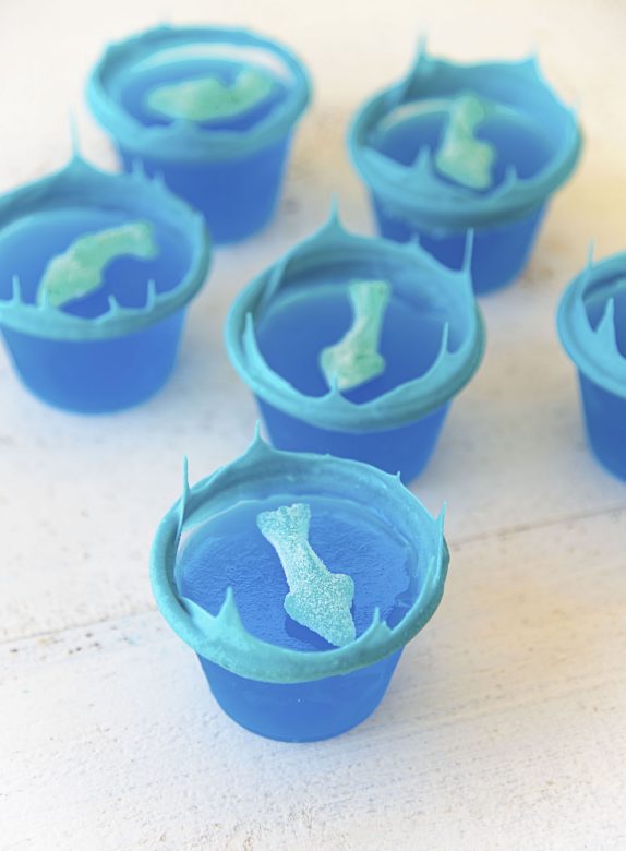 Ocean Water Jello Shots with White Chocolate Waves and Gummy Sharks