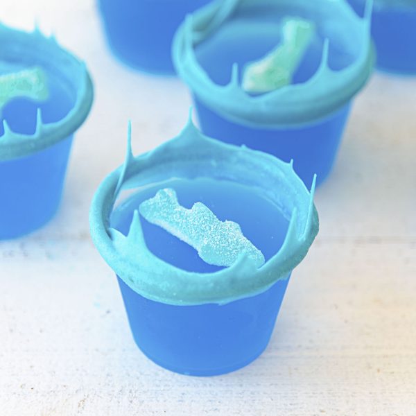 Ocean Water Jello Shots with White Chocolate Waves and Gummy Sharks