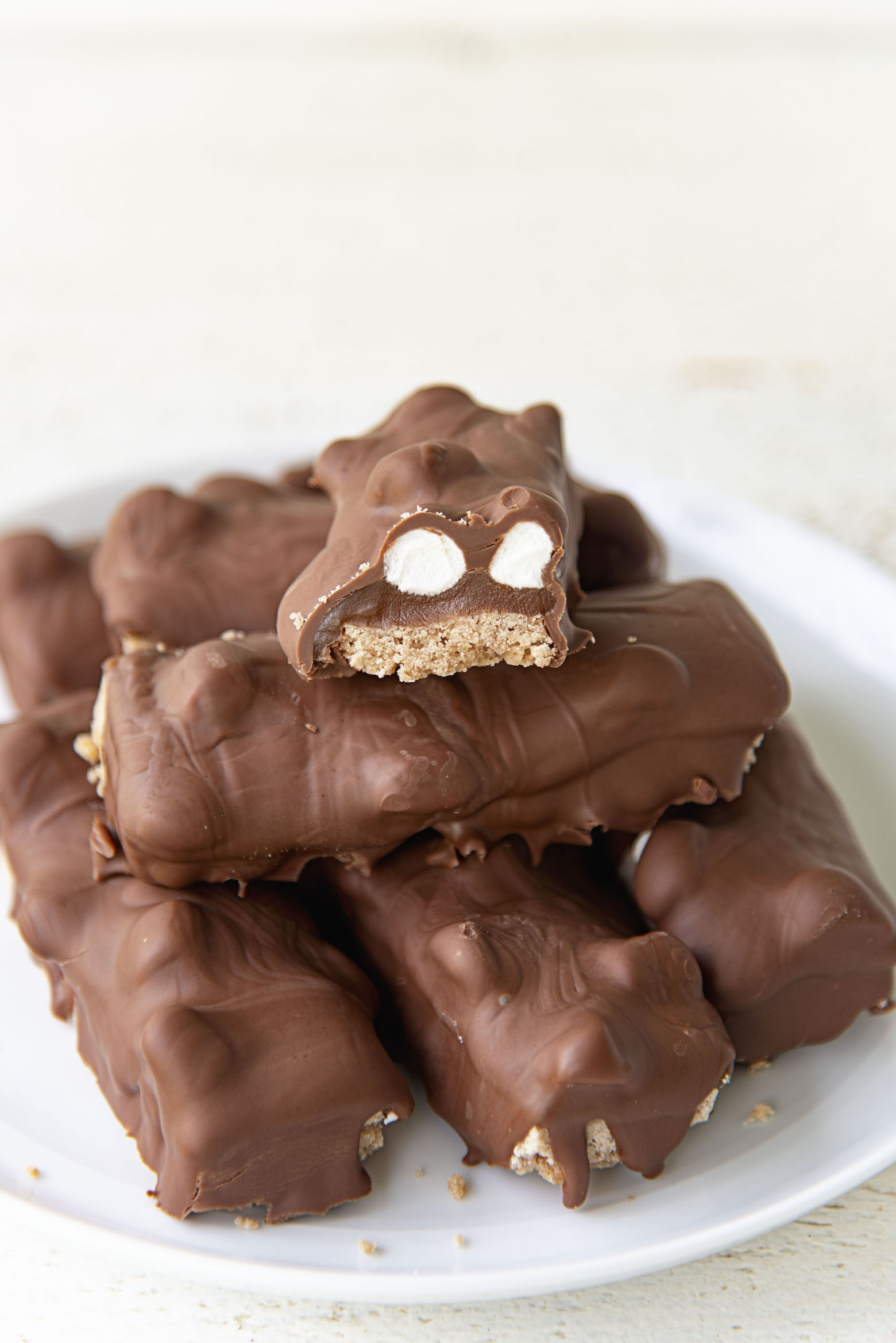 Stack of Hot Chocolate bars with one cut in half exposing the middle. 