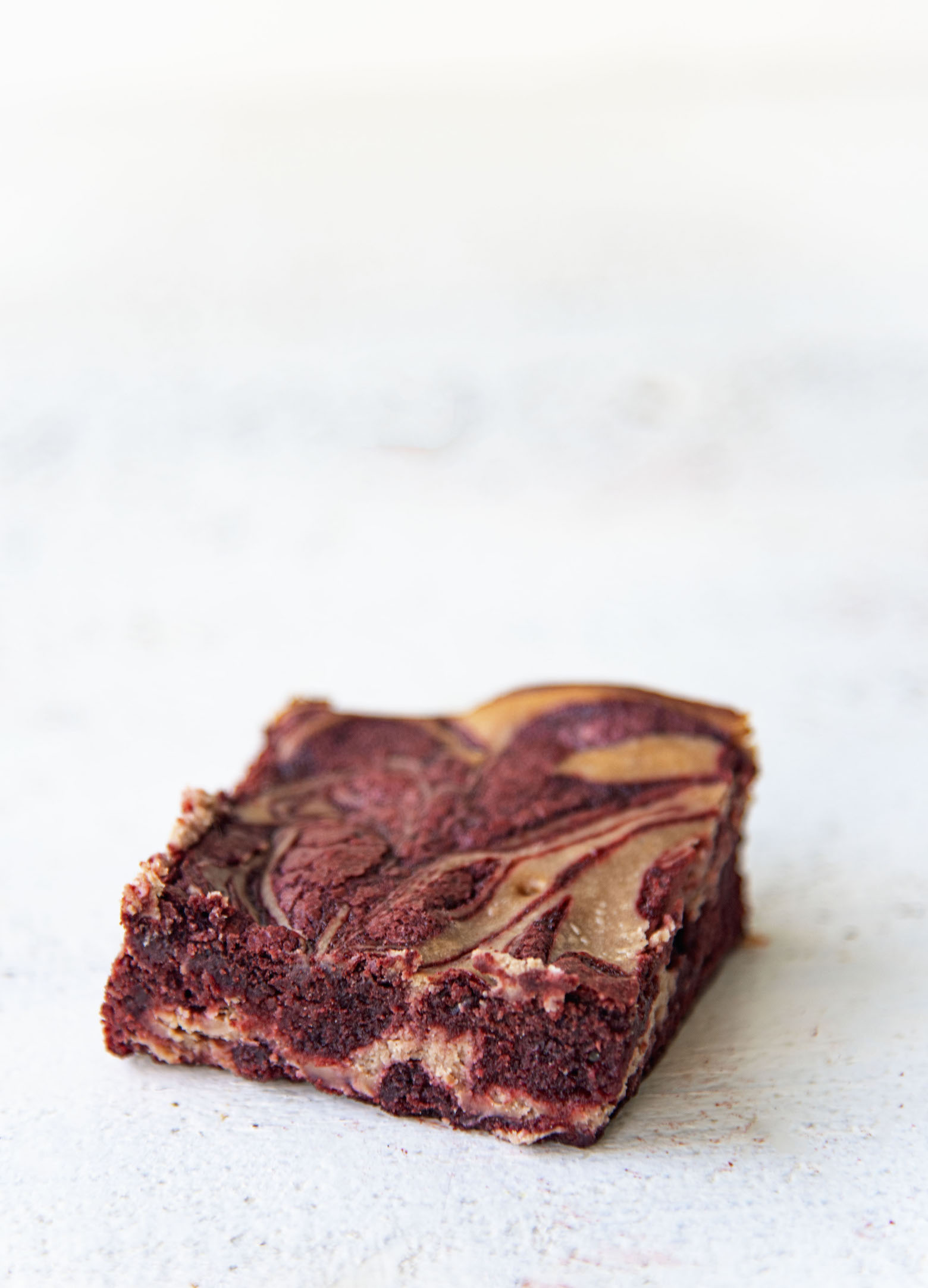 Single shot of one red velvet hot chocolate brownie.