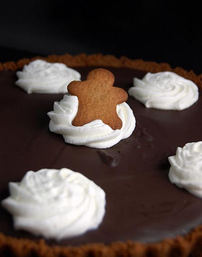 Upclose shot of gingerbread man on the Semisweet Chocolate Tart with Gingersnap Crust