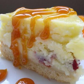 White Chocolate Cranberry Cheesecake with Satsuma Caramel Sauce