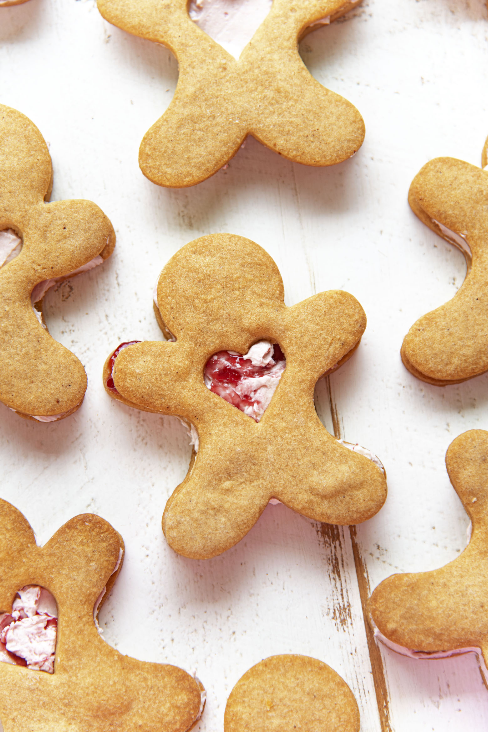 Overhead shot of Gingerbread Shortbread Sandwich Cookies with focus on the center cookie. 