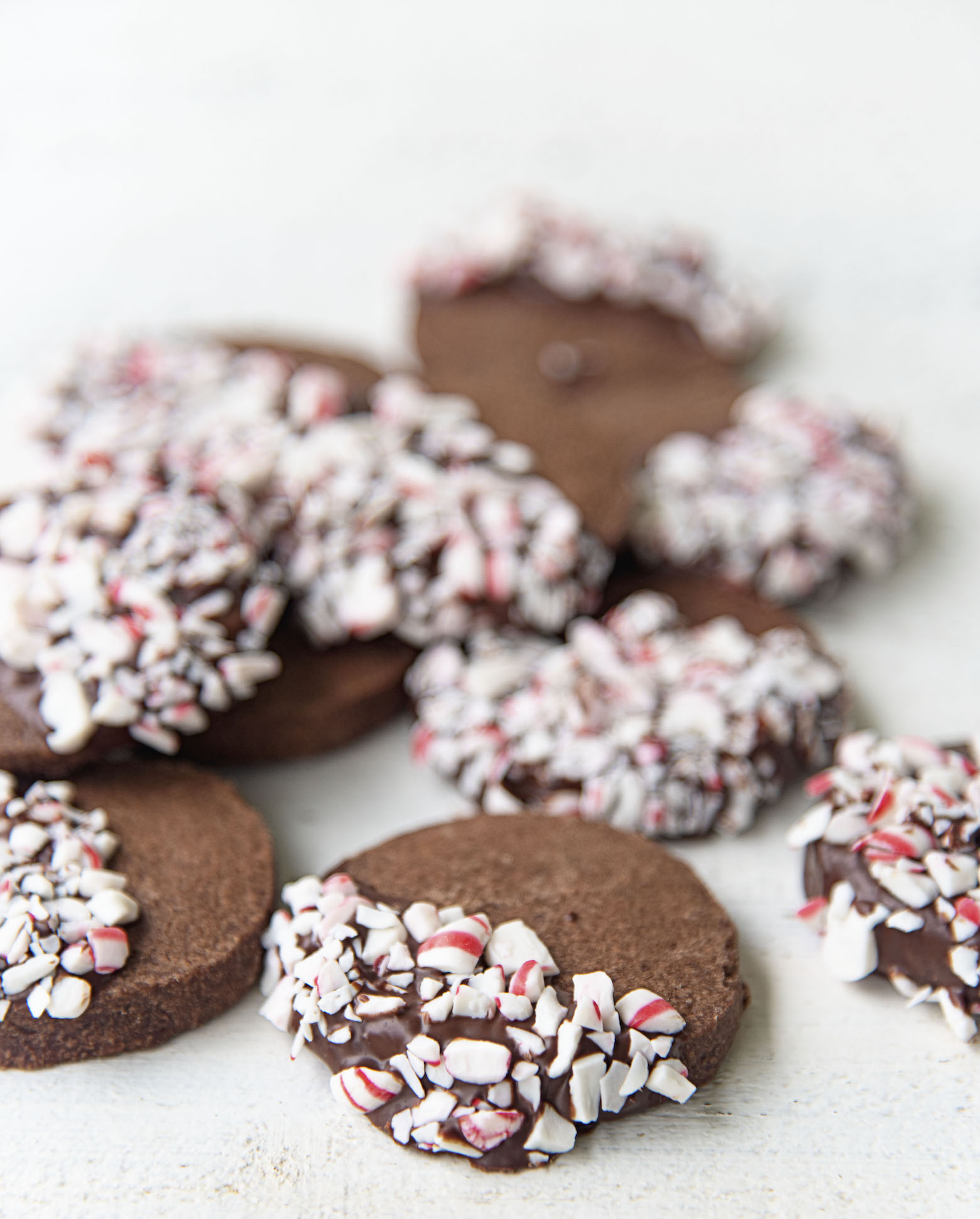 Scattering of Peppermint Mocha Shortbread with focus on single cookie. 