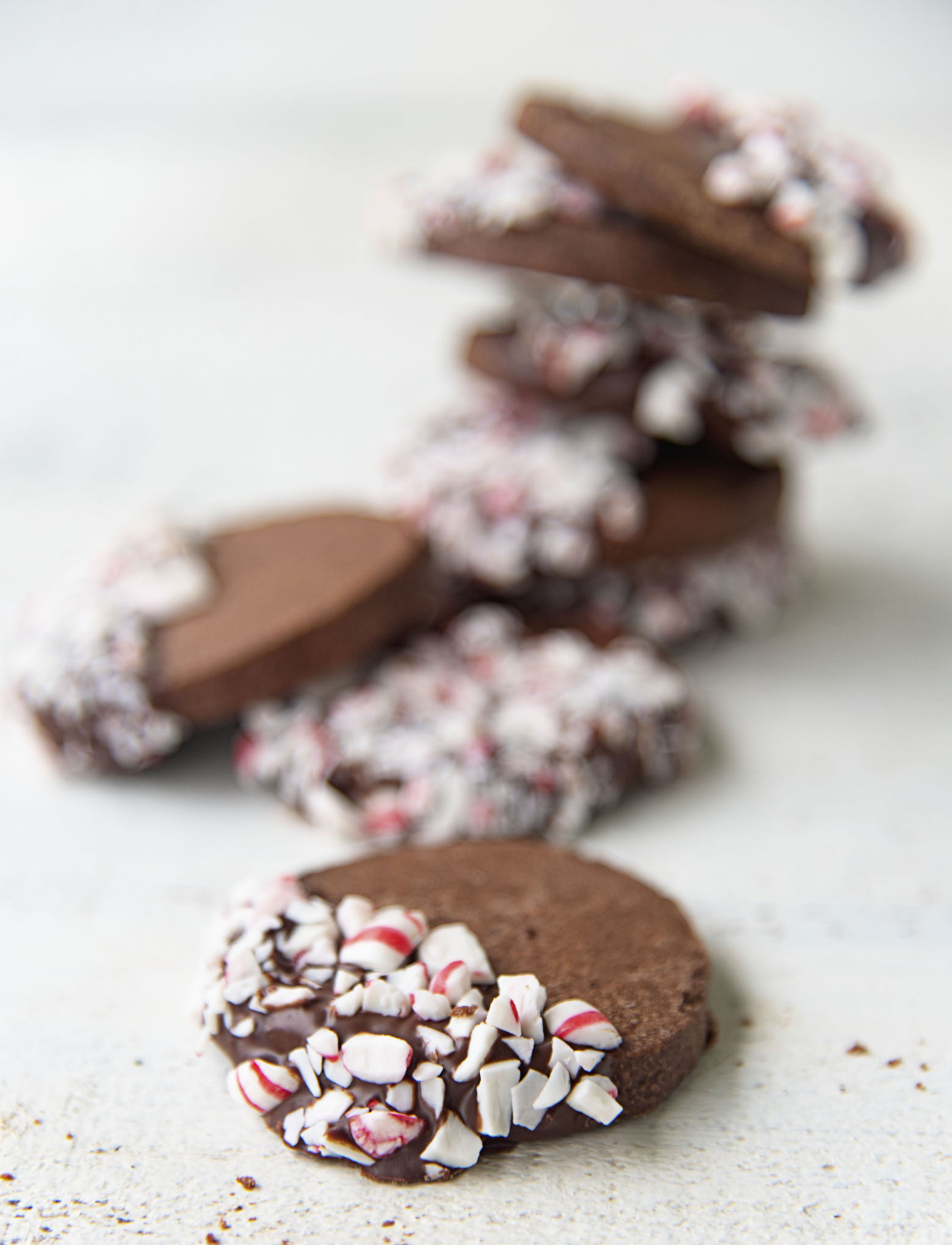 Close up of the chocolate dipped candy cane pieces on the shortbread.