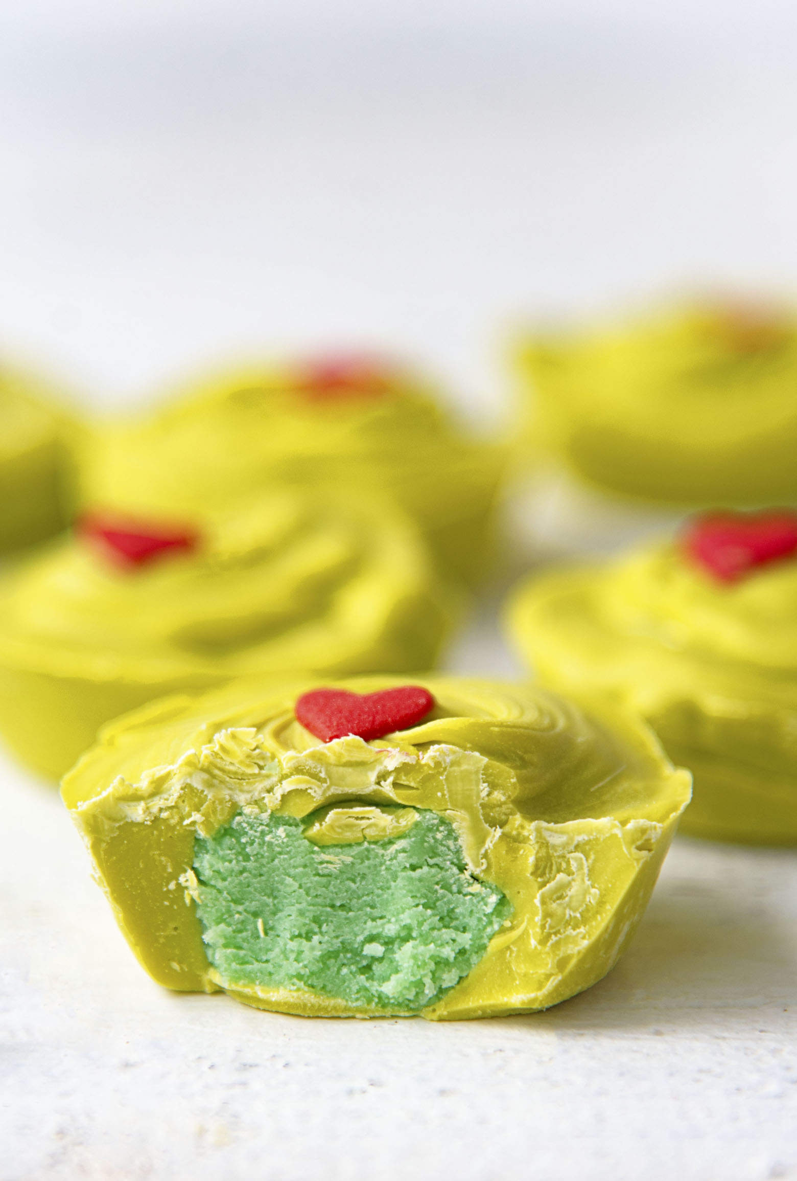 Close up side view of cut open The Grinch Sugar Cookie Cup