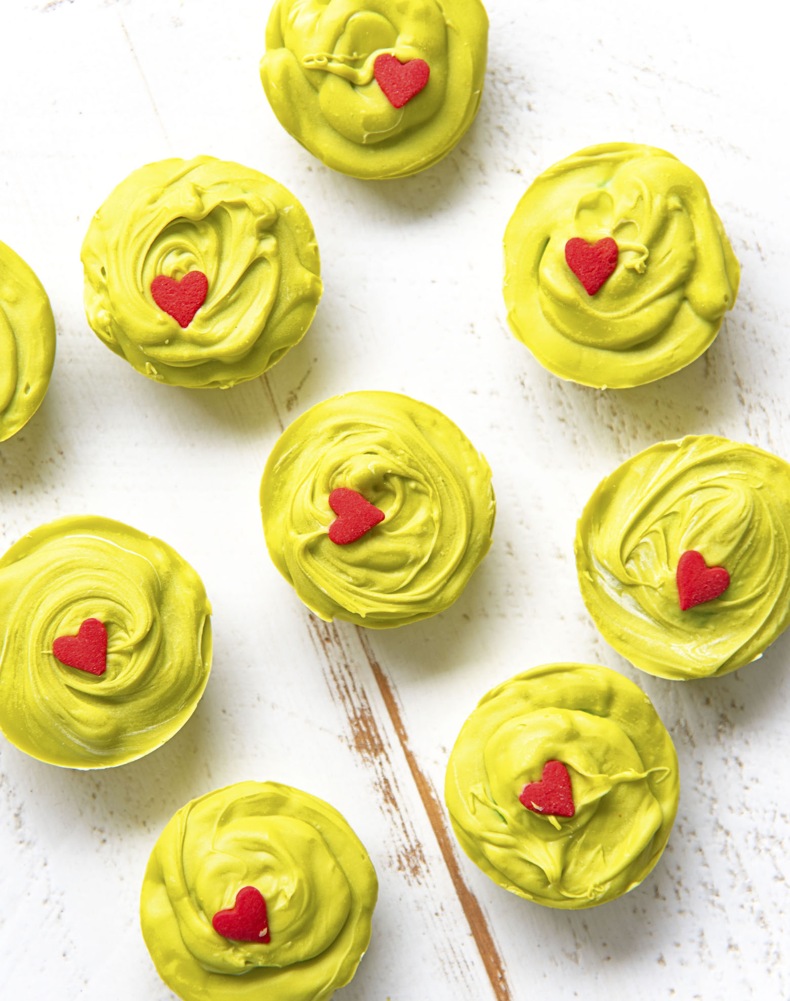 Overhead shot of nine The Grinch Sugar Cookie Cups 