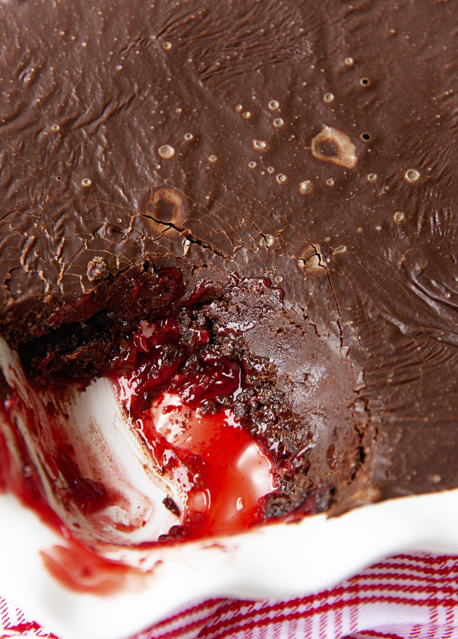 Overhead shot of the Dr. Pepper Chocolate Dump Cake with a scoop taken out of it. 